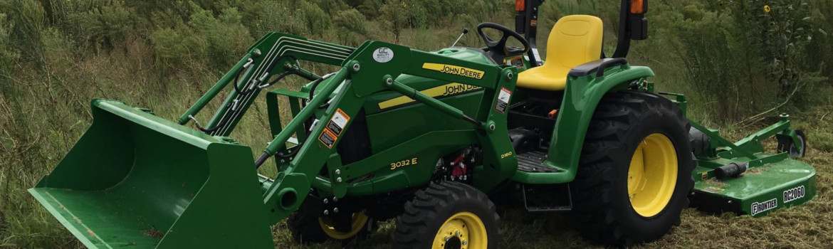 a John Deere® 3025E tractor sitting in a field.